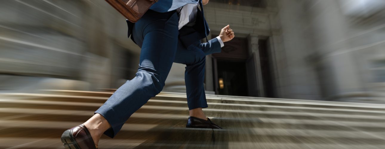Businessman with briefcase stepping up the stairs quickly for get fund and loan, Busy man is in a hurry, time is money, Business concept.